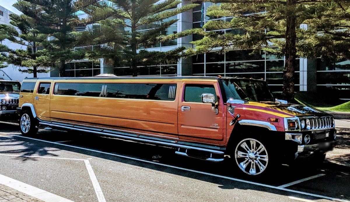 The Golden Sunset gold stretch Hummer limousine seen from the side